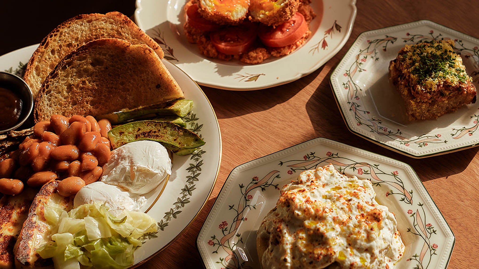 Brunch plates at Ardfern — toast, fritters and salads across the table
