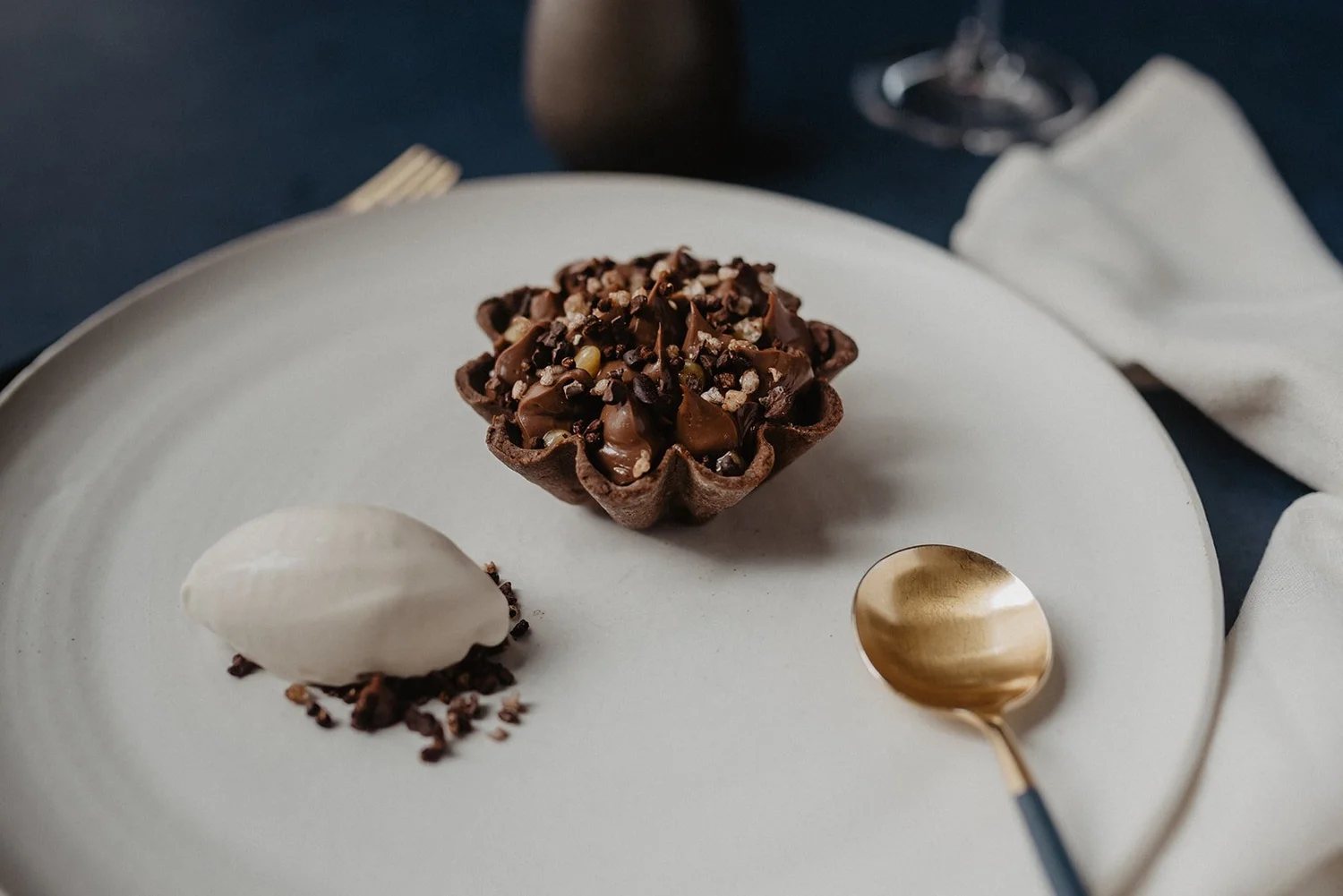 Chocolate tart with a quenelle of ice cream